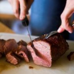cutting up steak